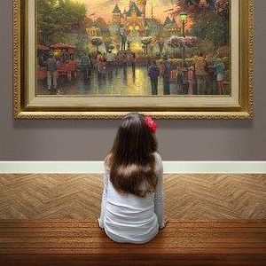 Image of a young girl in an art gallery looking at a Limited Edition piece of art